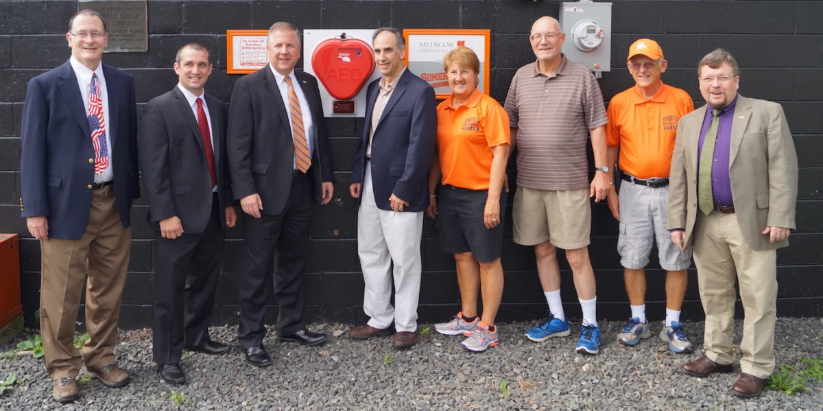 Medicor Cardiology and Somerville Recreation leaders stand beside newly installed AED donated to Somerset County community