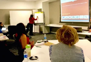 Dr. Rachana Kulkarni presenting a heart health education session to employees during a corporate wellness presentation.